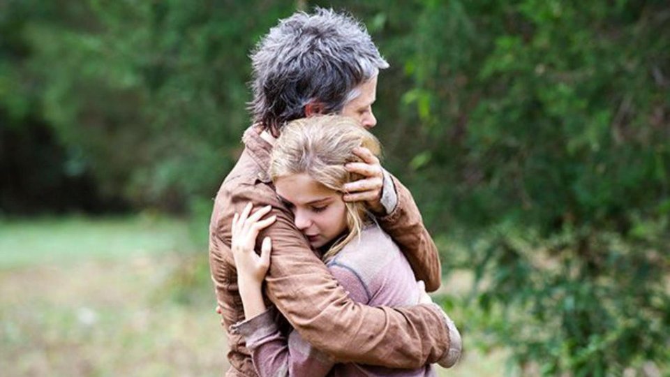Brighton Sharbino as Lizzie embraced by Melissa McBride in The Walking Dead